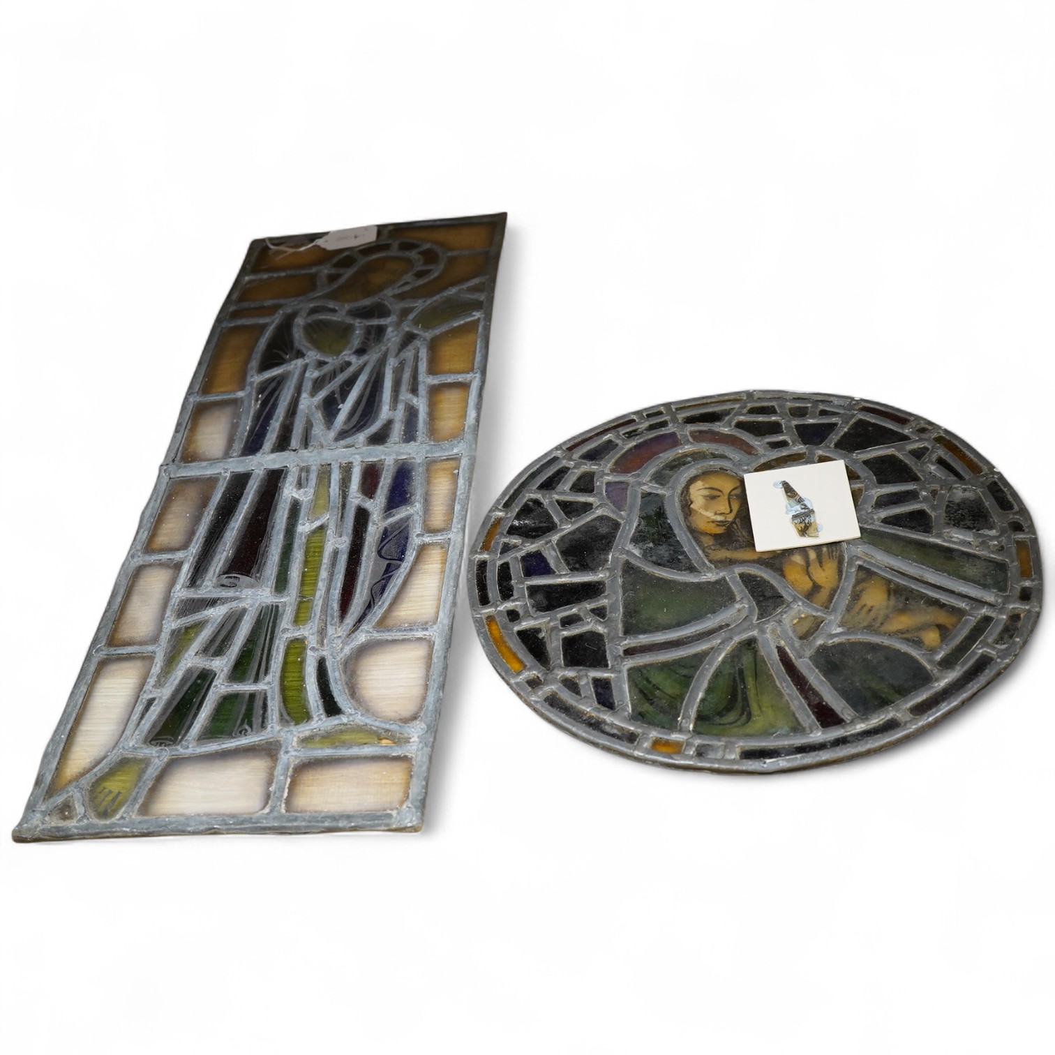 Max Parsons (1915-1998), Leaded stained glass panels, roundel of the virgin child and a full length study of a saint, largest 72cm high